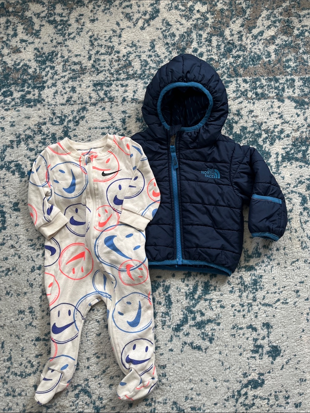 Bundle of baby boy Nike footie pajamas and a Northface puffer coat